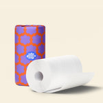 Wrapped and naked rolls of Who Gives a Crap paper towel 