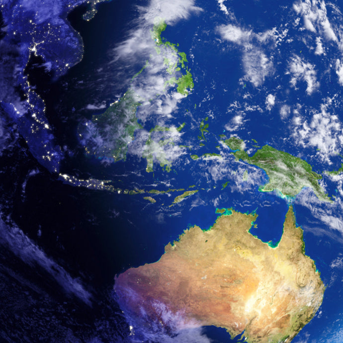 Planet Earth from space with swirling clouds of white and streaks of city lights.